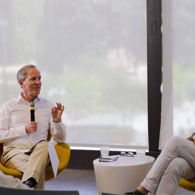 Duke Reiter and Jeff Goodell seated before an audience at Gensler L.A.
